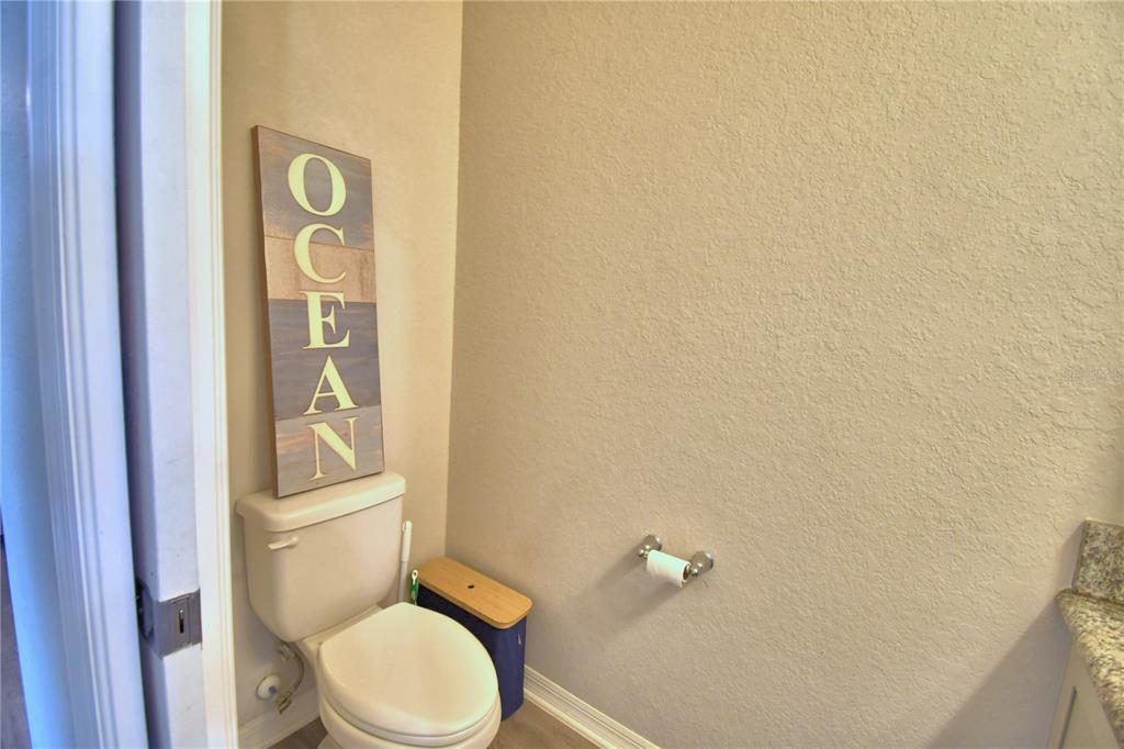 4340 Reding Way Lakeland, FL 33813 - Photo 25 of 63 a white toilet sitting next to a shower curtain