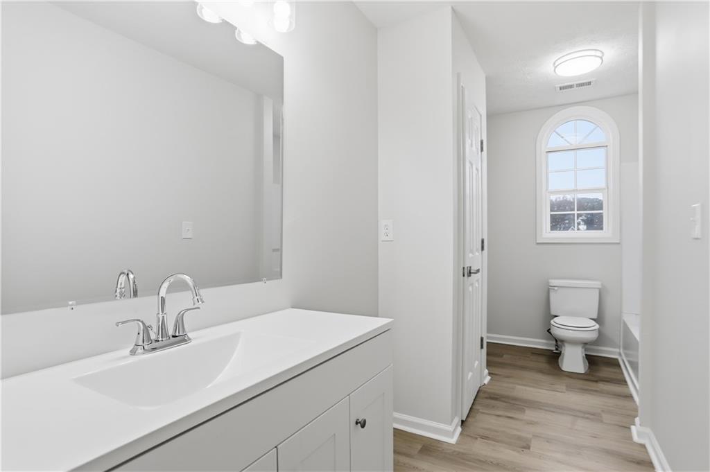 5556 Claridge Circle Stonecrest, GA 30038 - Photo 19 of 25 a bathroom with a sink and a toilet