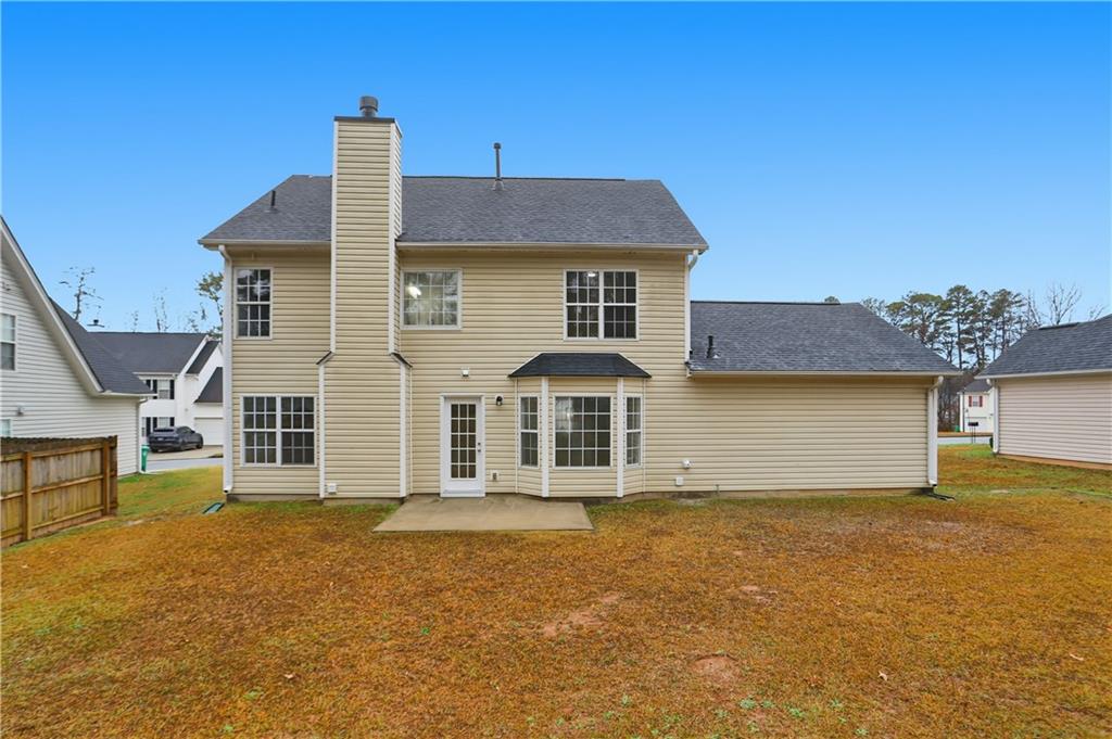 5556 Claridge Circle Stonecrest, GA 30038 - Photo 23 of 25 a front view of a house with a yard