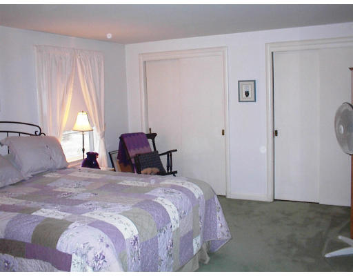 555 Potter Road Framingham, MA 01701 - Photo 8 of 11 a bedroom with a bed and a window