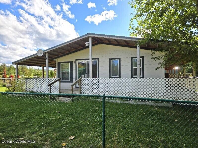 871 Foothill Drive Athol, ID 83801 - Photo 7 of 46 wrap deck on home