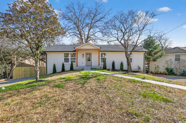 a house with trees in front of it