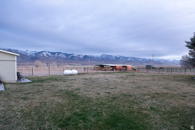 1981 South Main Street Lewiston, UT 84320 - Photo 45 of 47 View of yard with a rural view, a mountain view, an outbuilding, and an exterior structure