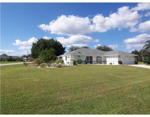 1355 Navigator Road Punta Gorda, FL 33983 - Photo 1 of 1 Exterior Front - Over a half acre on a corner lot. Lot behing home is also included and already combined in tax records. Dead end stree and a huge green belt on side lot!