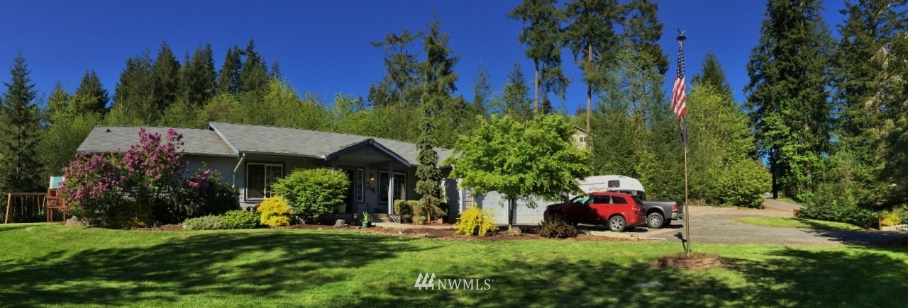 107 Hillcrest Road Chehalis, WA 98532 - Photo 1 of 25 a view of a house with a yard and sitting area