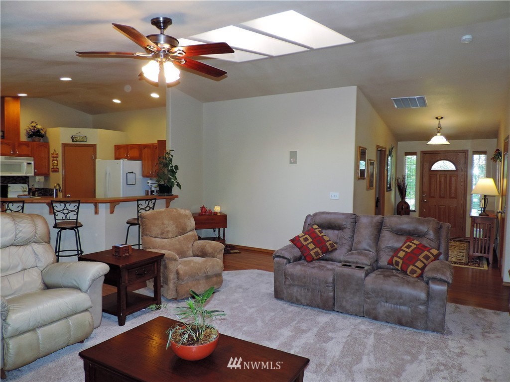 107 Hillcrest Road Chehalis, WA 98532 - Photo 5 of 25 a living room with furniture and a chandelier