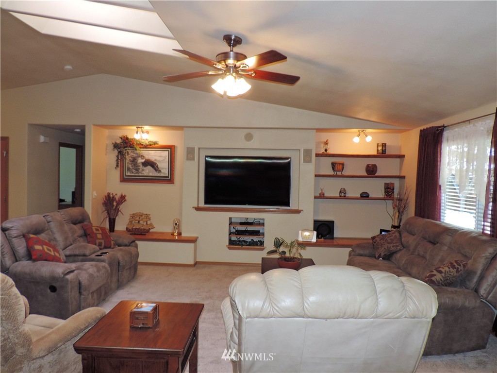 107 Hillcrest Road Chehalis, WA 98532 - Photo 6 of 25 a living room with furniture and a flat screen tv