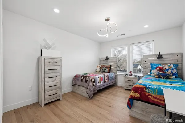 a bedroom with bed and a window