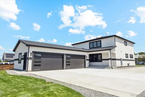 a view of a house with a garage and a garage