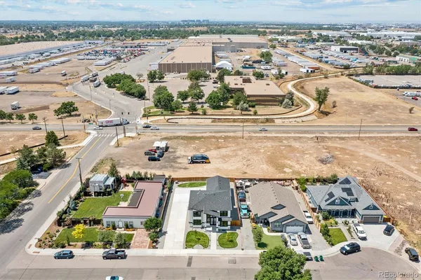 an aerial view of residential houses with outdoor space