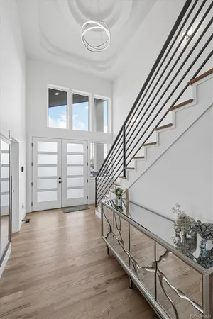 a view of an entryway with wooden floor