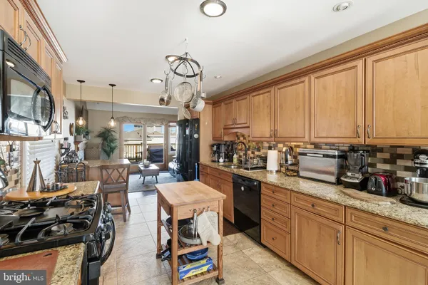 a kitchen with lots of counter top space and stainless steel appliances
