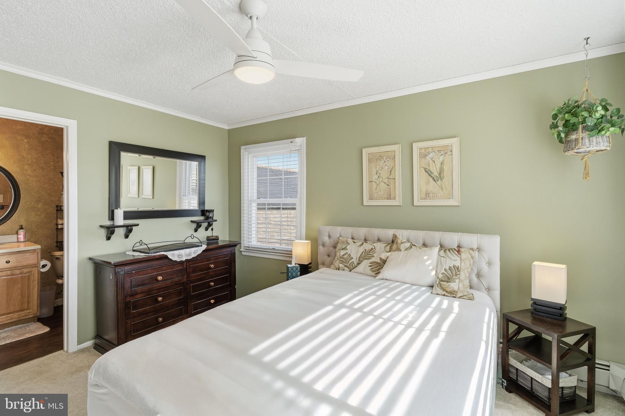 179 Bernard Drive Manahawkin, NJ 08050 - Photo 22 of 35 a bedroom with a bed and wooden floor