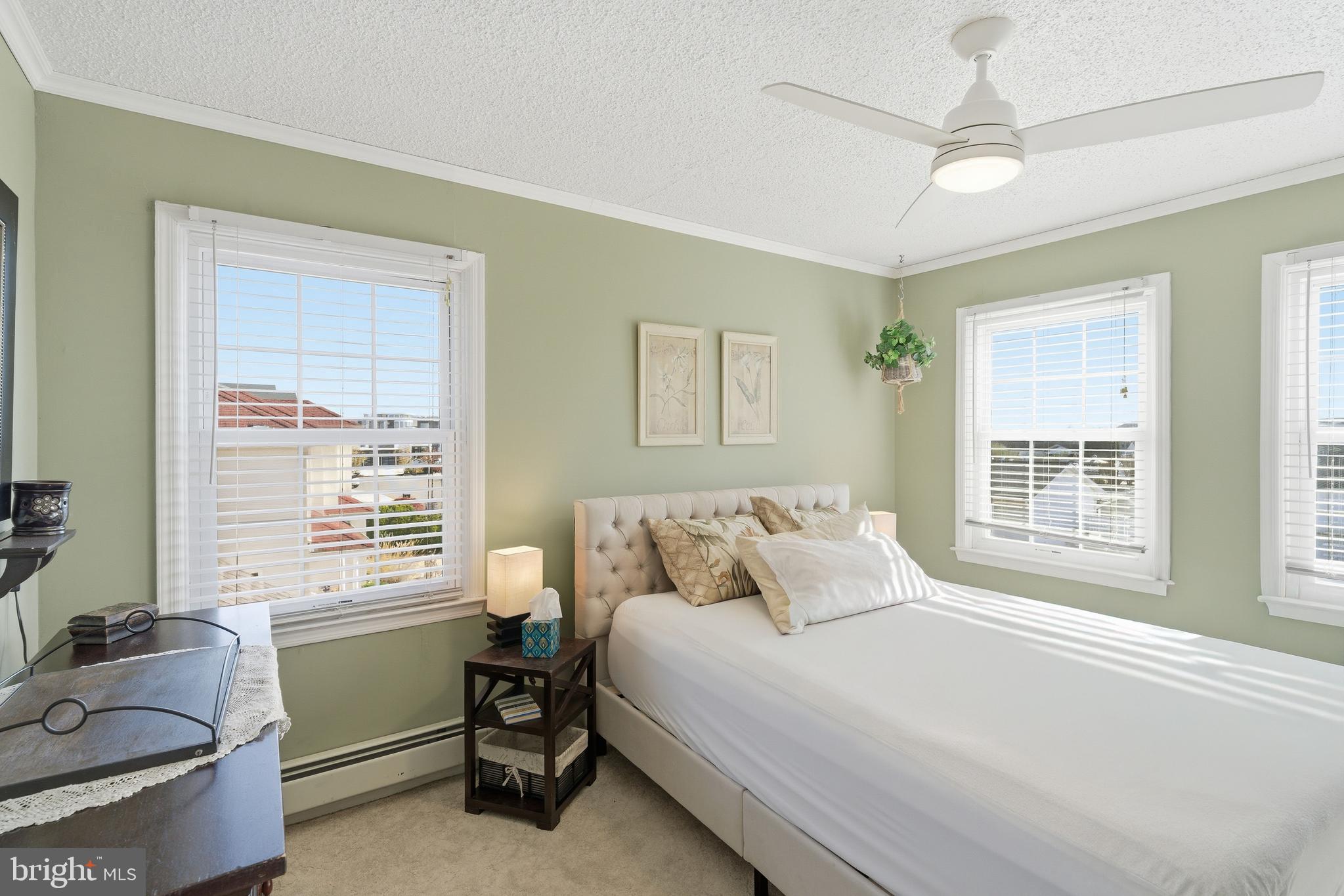 179 Bernard Drive Manahawkin, NJ 08050 - Photo 24 of 35 a bedroom with a bed and a dresser next to a window