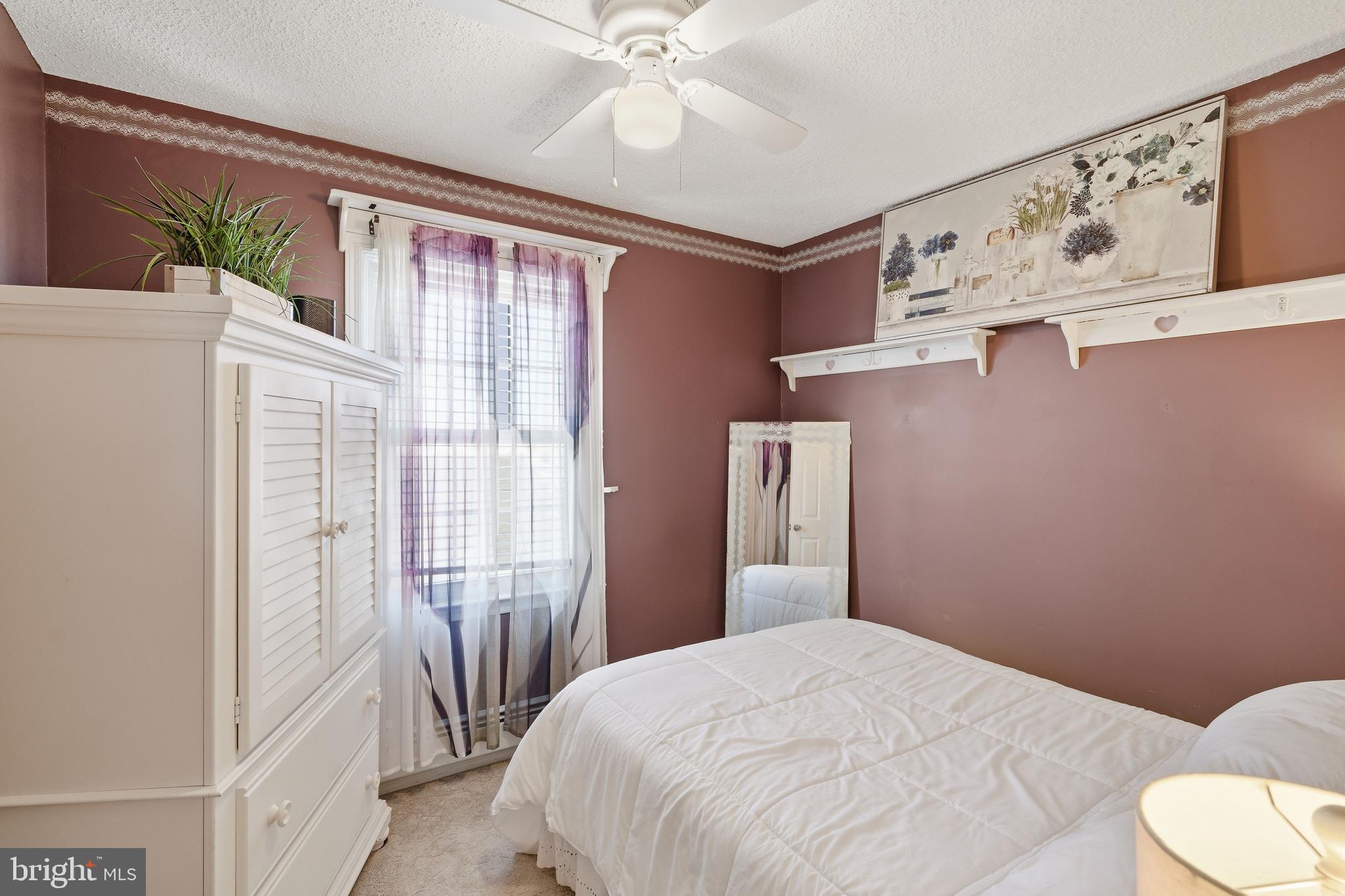 179 Bernard Drive Manahawkin, NJ 08050 - Photo 26 of 35 a bedroom with a bed and a window