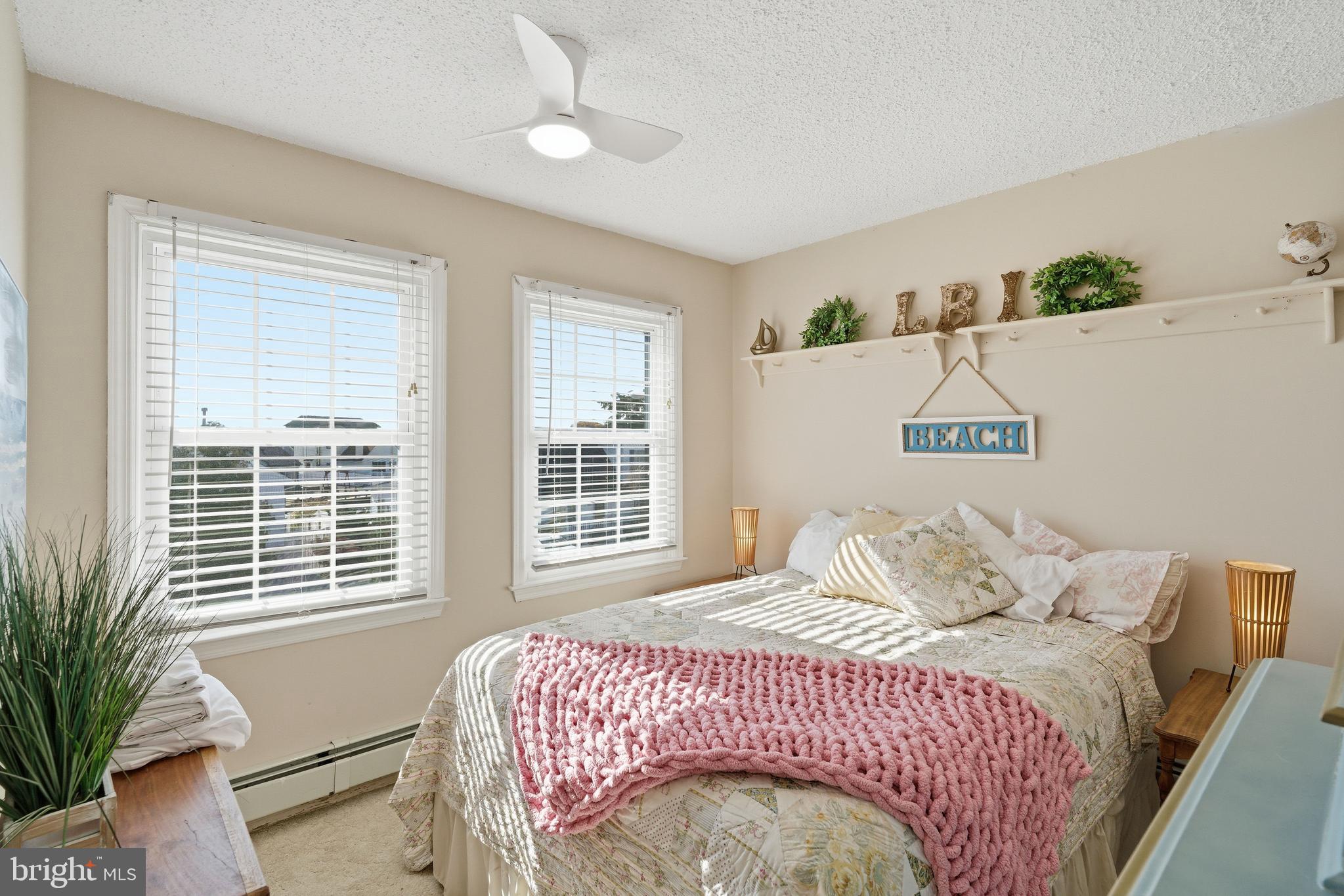 179 Bernard Drive Manahawkin, NJ 08050 - Photo 27 of 35 a bedroom with a large bed and a window
