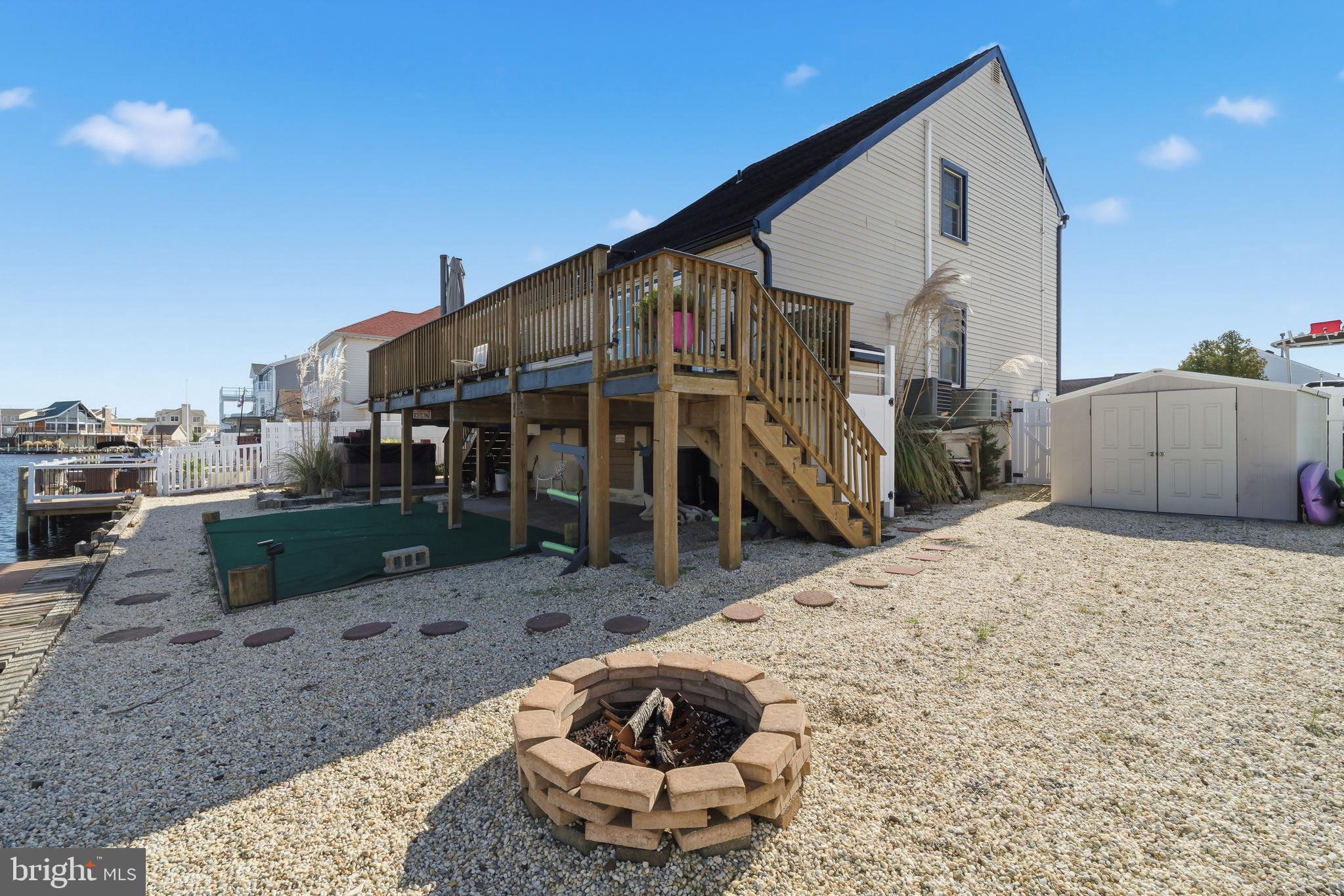 179 Bernard Drive Manahawkin, NJ 08050 - Photo 33 of 35 a view of a house with backyard and sitting area