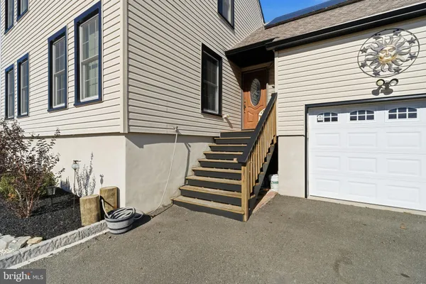 a view of a house with a door and a window