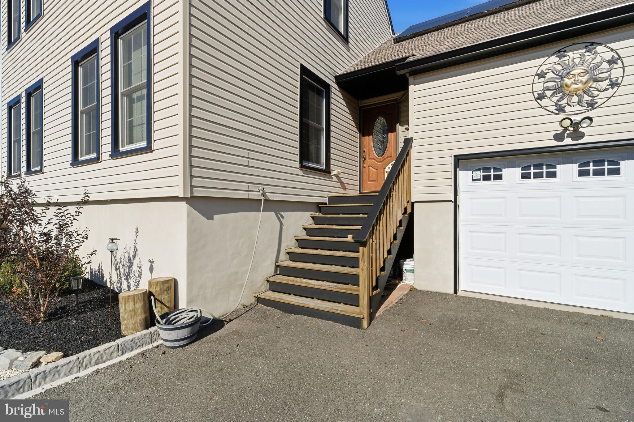 179 Bernard Drive Manahawkin, NJ 08050 - Photo 4 of 35 a view of a house with a door and a window