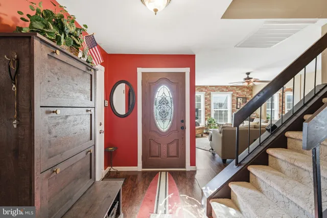 a view of entryway with wooden floor