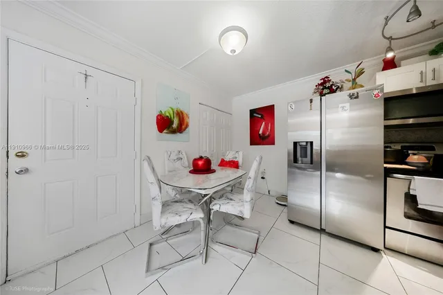 a kitchen with stainless steel appliances cabinets a sink and a stove