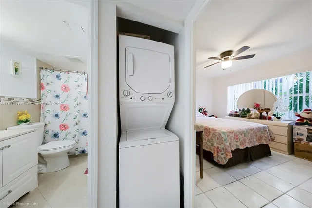 a bedroom with a bed dresser and a window