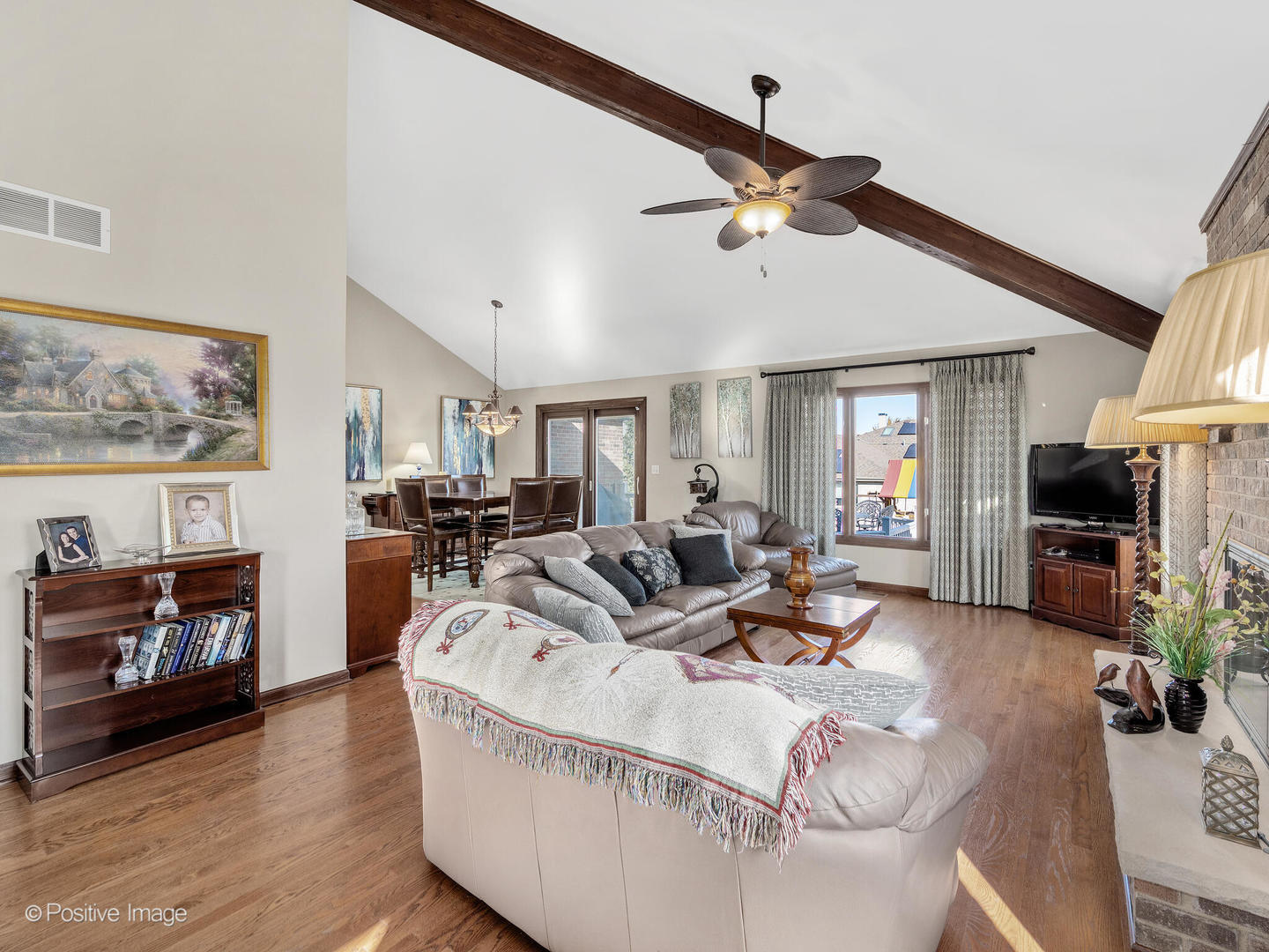 1306 Chauser Lane Woodridge, IL 60517 - Photo 11 of 40 a living room with furniture and a fireplace