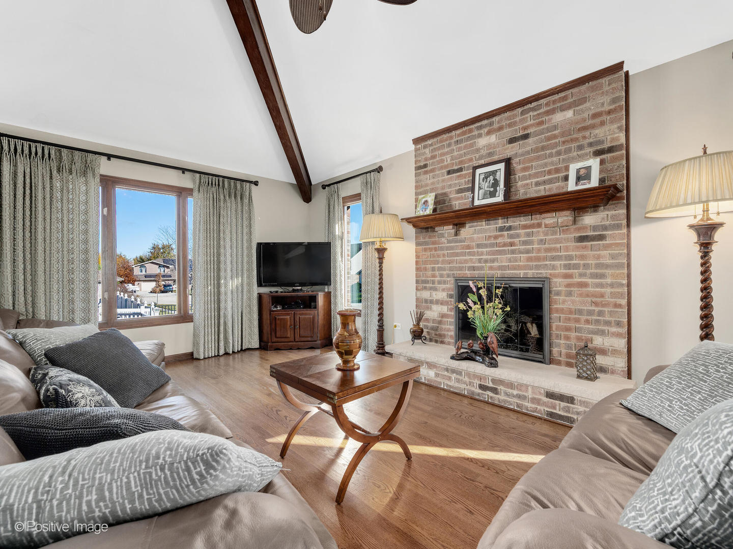 1306 Chauser Lane Woodridge, IL 60517 - Photo 12 of 40 a living room with furniture and a fireplace