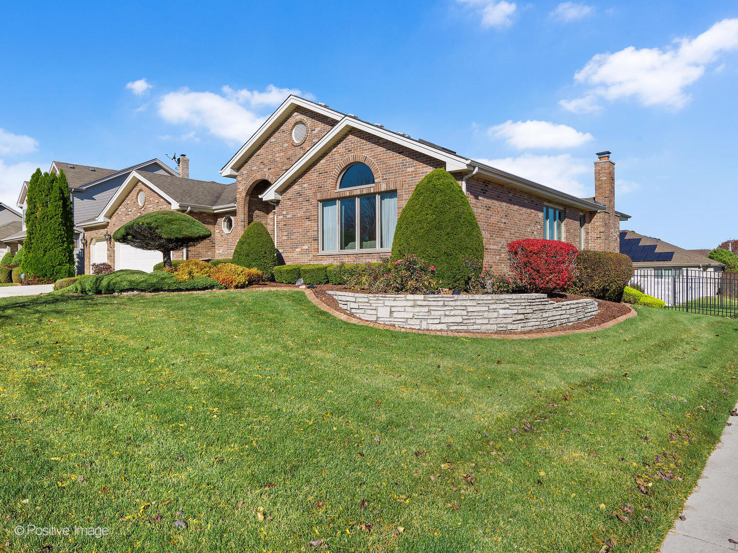 1306 Chauser Lane Woodridge, IL 60517 - Photo 2 of 40 a front view of a house with a yard and garage
