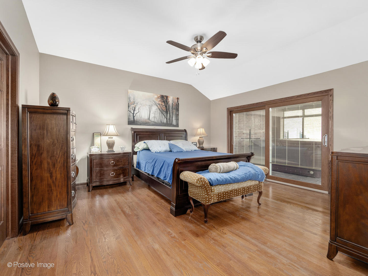 1306 Chauser Lane Woodridge, IL 60517 - Photo 22 of 40 a bedroom with a bed and wooden floor