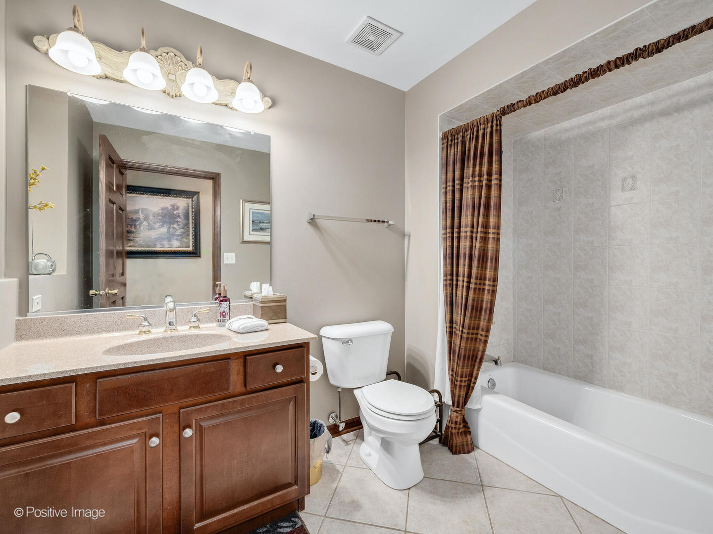 1306 Chauser Lane Woodridge, IL 60517 - Photo 26 of 40 a bathroom with a sink a toilet and shower