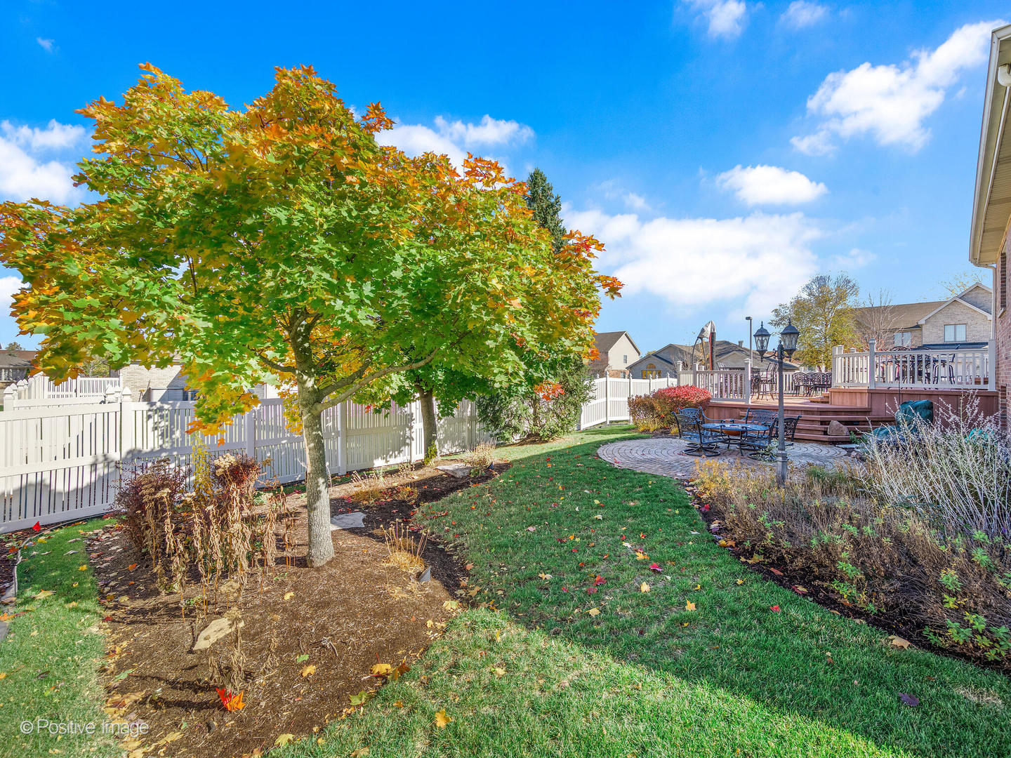 1306 Chauser Lane Woodridge, IL 60517 - Photo 38 of 40 a view of a garden with a building in the background