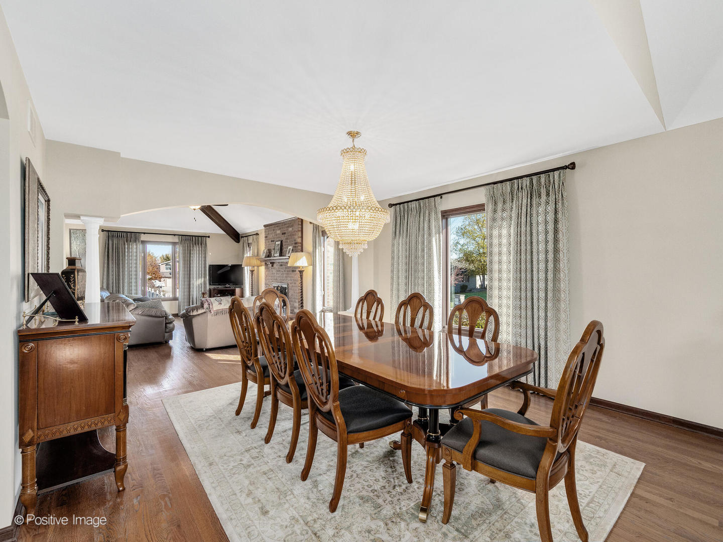 1306 Chauser Lane Woodridge, IL 60517 - Photo 8 of 40 a dining room with furniture a chandelier and wooden floor