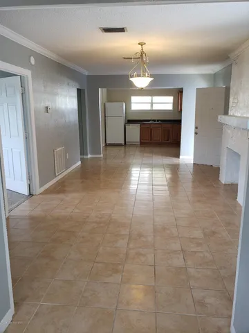 a kitchen with a stove sink and cabinets