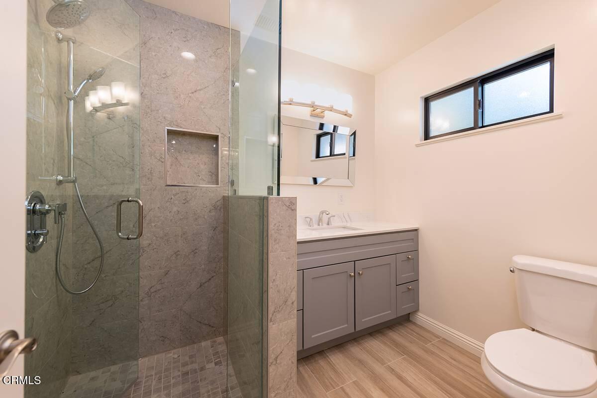 1068 Cuyama Road Ojai, CA 93023 - Photo 13 of 23 a bathroom with a toilet sink and shower