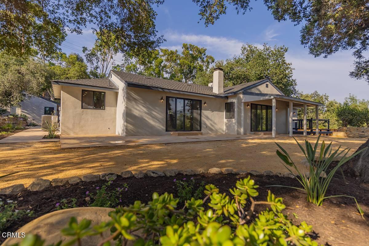 1068 Cuyama Road Ojai, CA 93023 - Photo 16 of 23 a front view of a house with a yard and garage