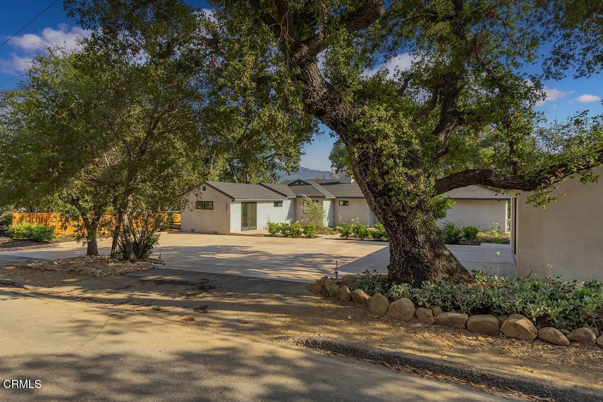1068 Cuyama Road Ojai, CA 93023 - Photo 23 of 23 a front view of a house with a yard and large trees