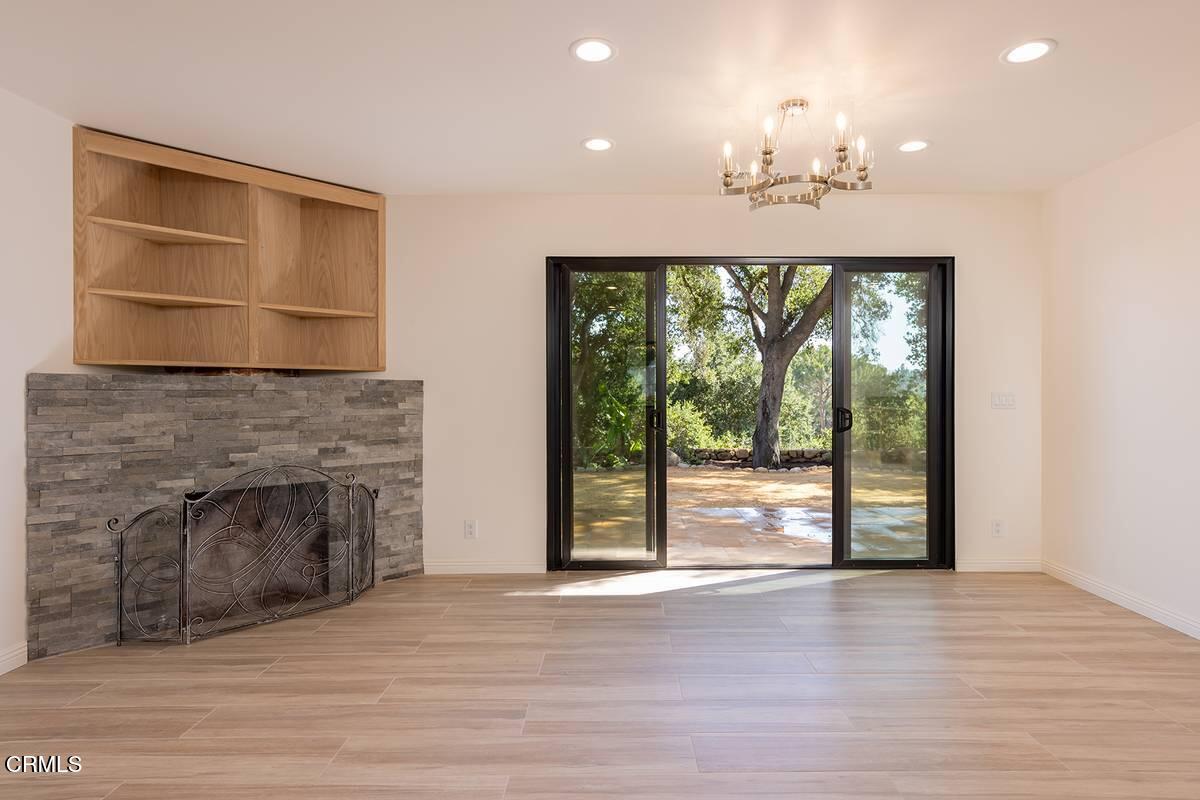 1068 Cuyama Road Ojai, CA 93023 - Photo 5 of 23 a view of an empty room with a fireplace and a window