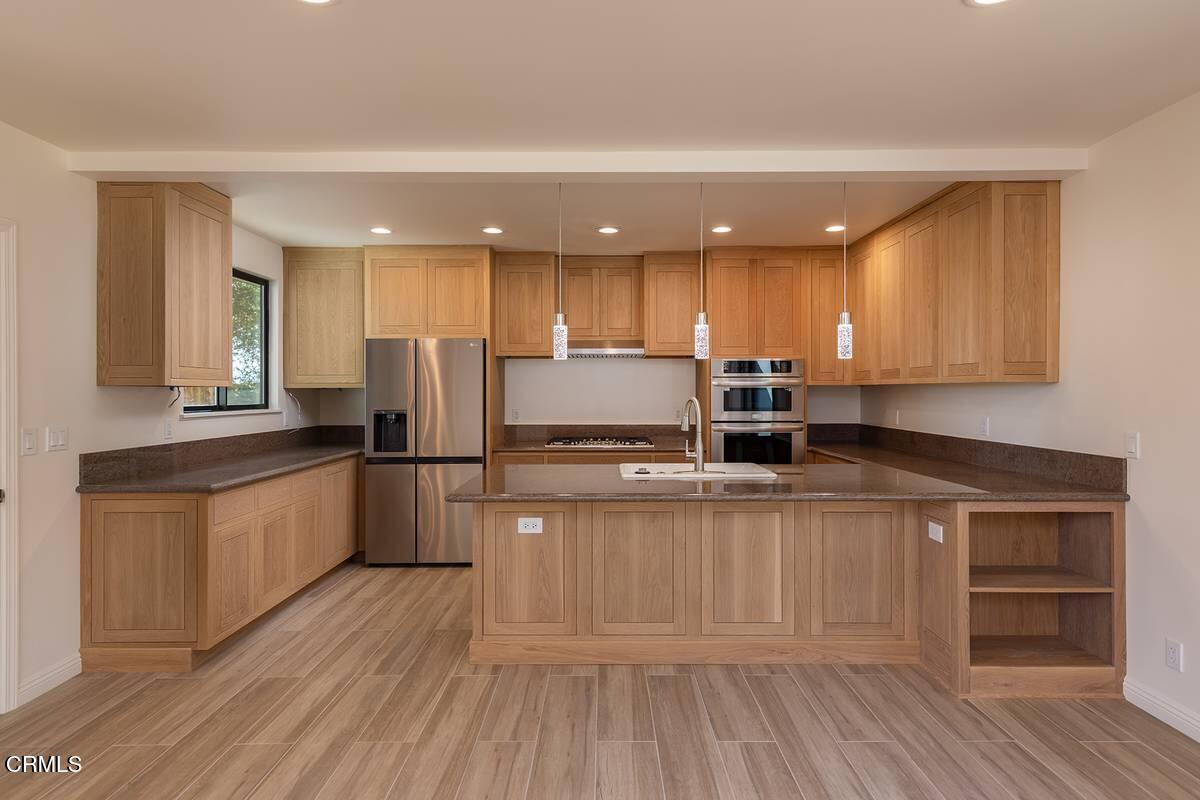 1068 Cuyama Road Ojai, CA 93023 - Photo 6 of 23 a kitchen with stainless steel appliances granite countertop a stove a sink and a refrigerator