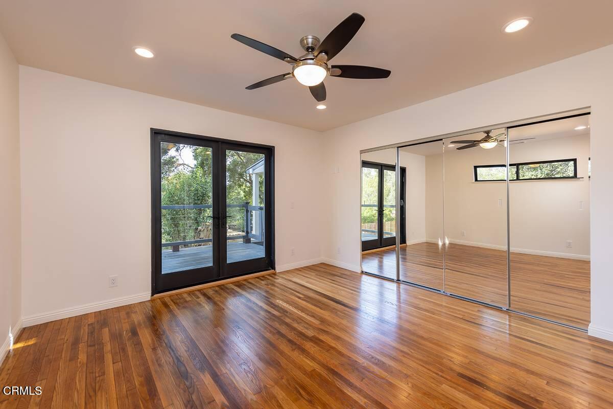 1068 Cuyama Road Ojai, CA 93023 - Photo 8 of 23 a view of an empty room with wooden floor and a window