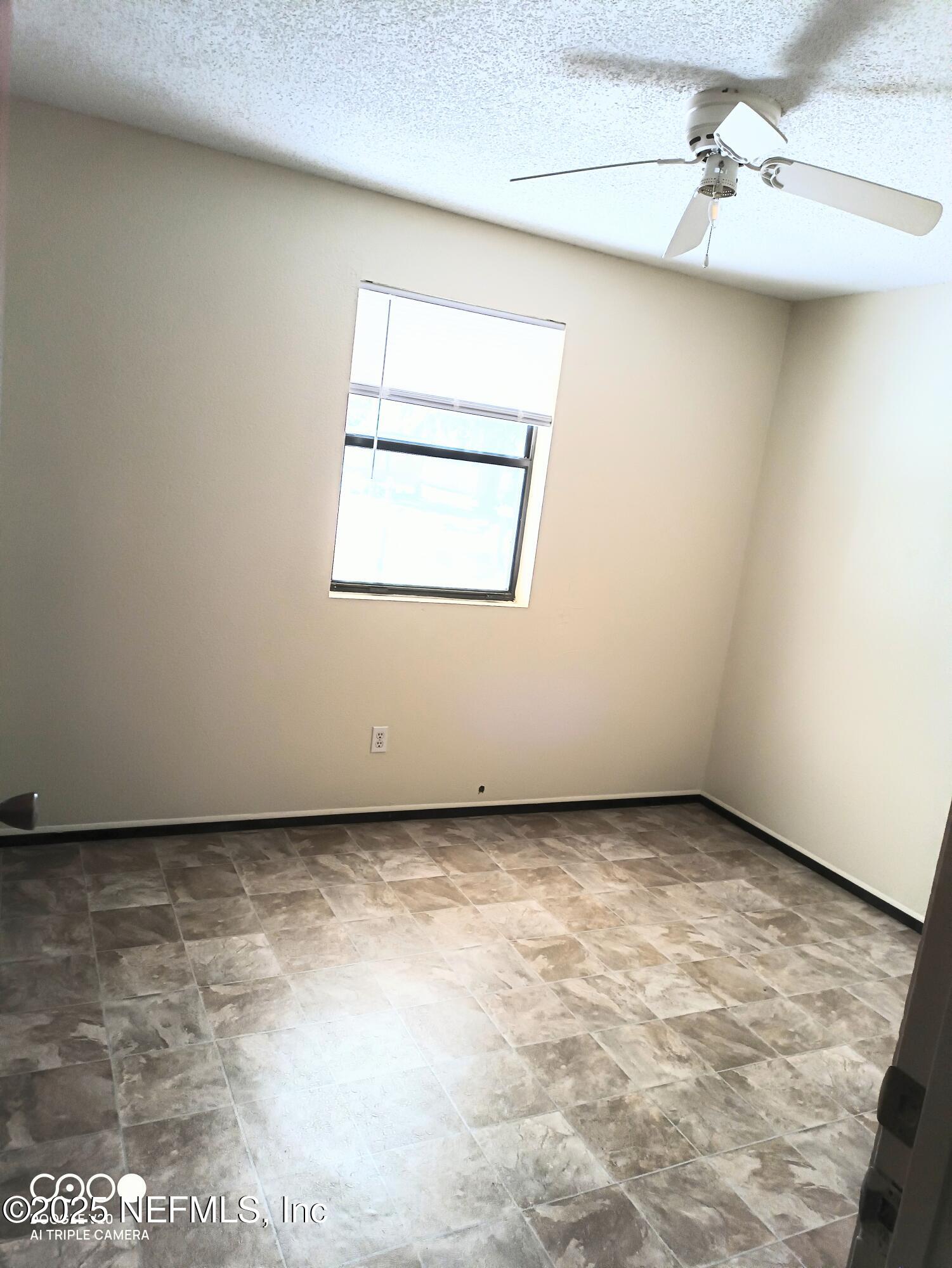 13926 Sanderson Circle Sanderson, FL 32087 - Photo 5 of 12 an empty room with a window
