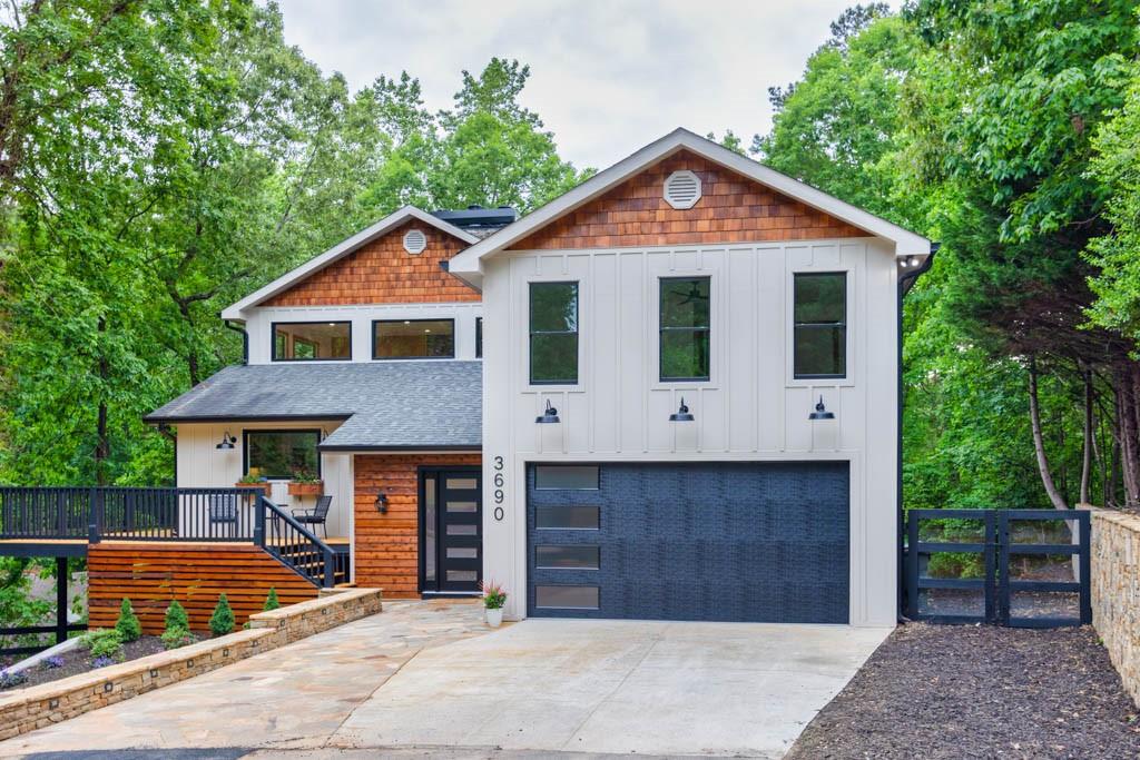 3690 Sinclair Shores Road Cumming, GA 30041 - Photo 1 of 1 a front view of a house with a yard and trees