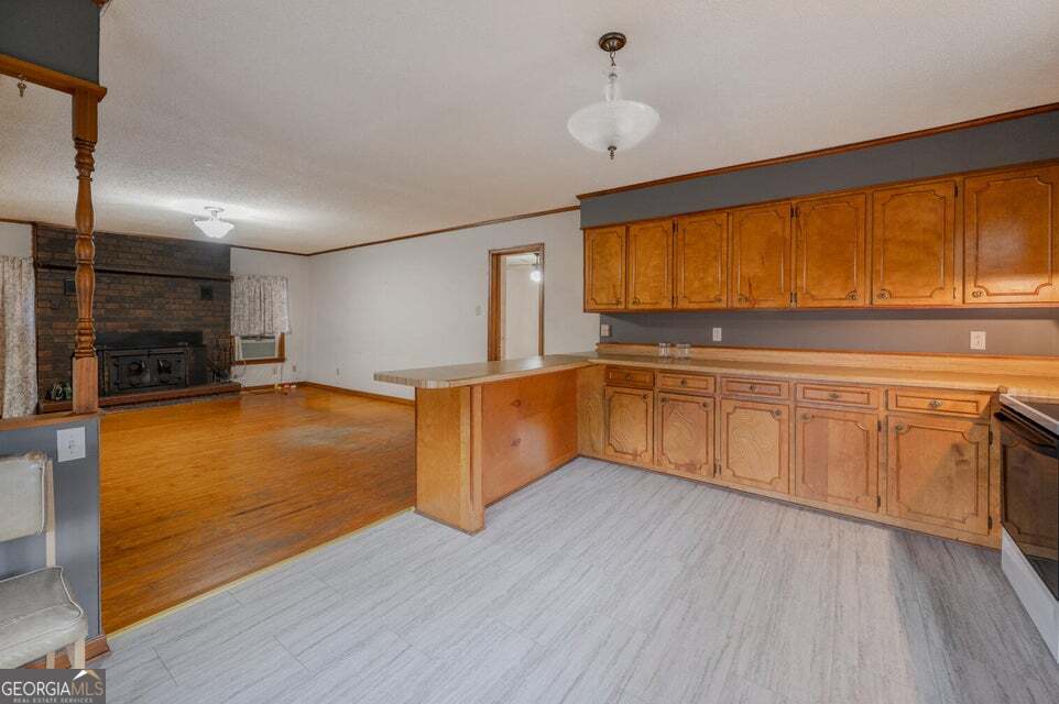 626 Greenbush Road LaFayette, GA 30728 - Photo 16 of 53 a kitchen with stainless steel appliances granite countertop a sink and cabinets with wooden floor