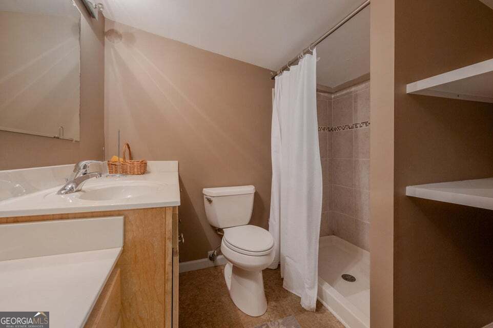 626 Greenbush Road LaFayette, GA 30728 - Photo 21 of 53 a bathroom with a sink toilet and shower