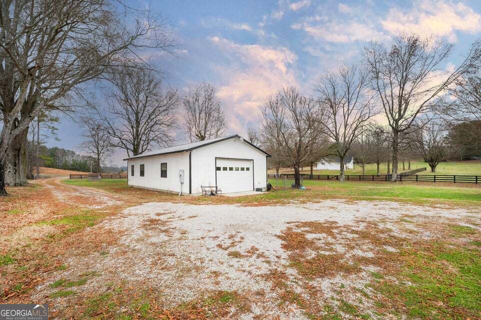 626 Greenbush Road LaFayette, GA 30728 - Photo 33 of 53 a view of white house with a big yard and large trees