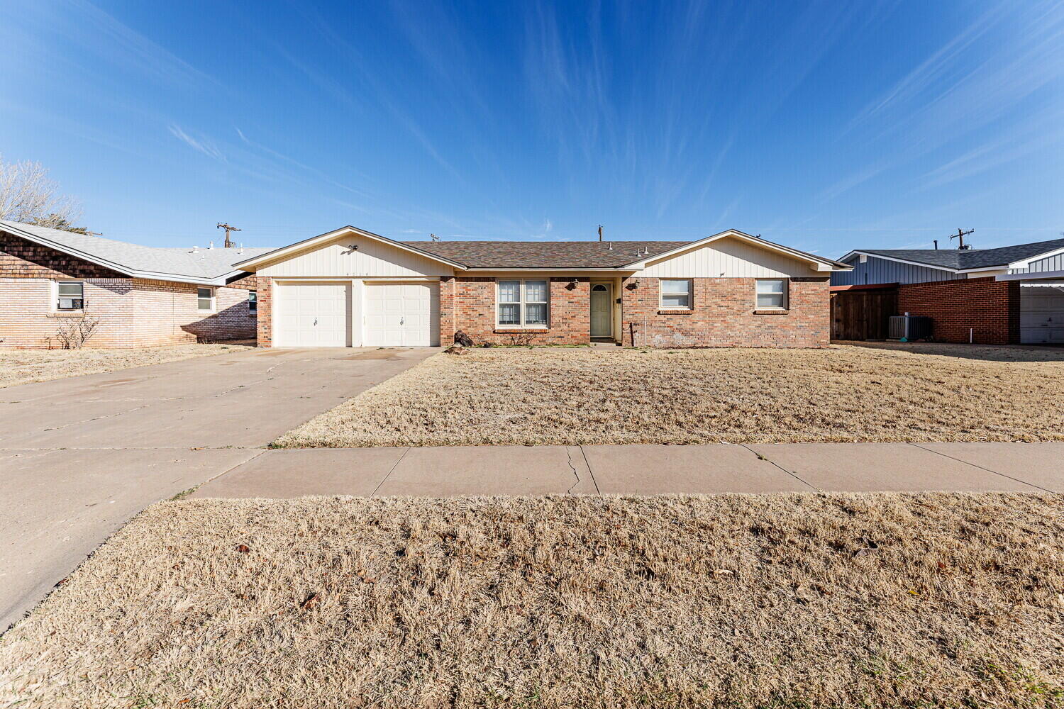 4714 46th Street Lubbock, TX 79414 - Photo 1 of 57 a front view of a house with a yard