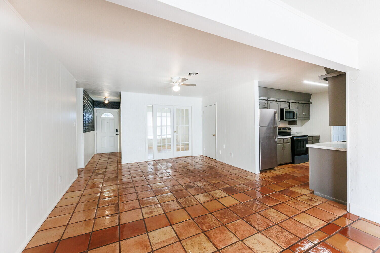 4714 46th Street Lubbock, TX 79414 - Photo 11 of 57 a view of a kitchen with wooden floor and a kitchen