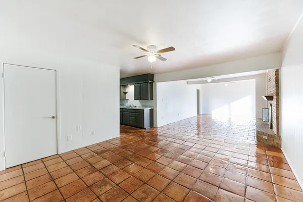 a kitchen with stainless steel appliances granite countertop a refrigerator a stove a sink dishwasher a microwave oven with granite countertops and cabinets