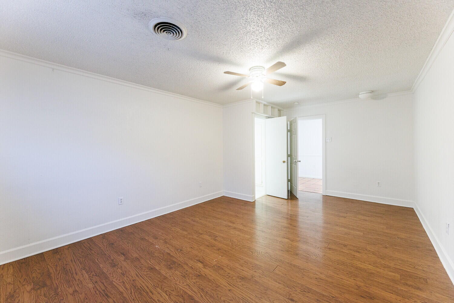 4714 46th Street Lubbock, TX 79414 - Photo 27 of 57 an empty room with wooden floor and windows