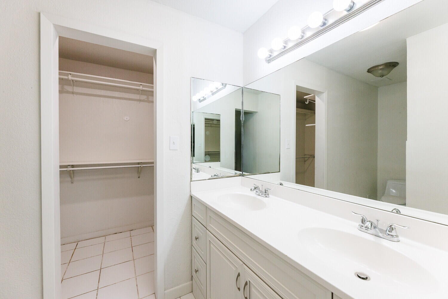 4714 46th Street Lubbock, TX 79414 - Photo 29 of 57 a bathroom with a sink and a mirror